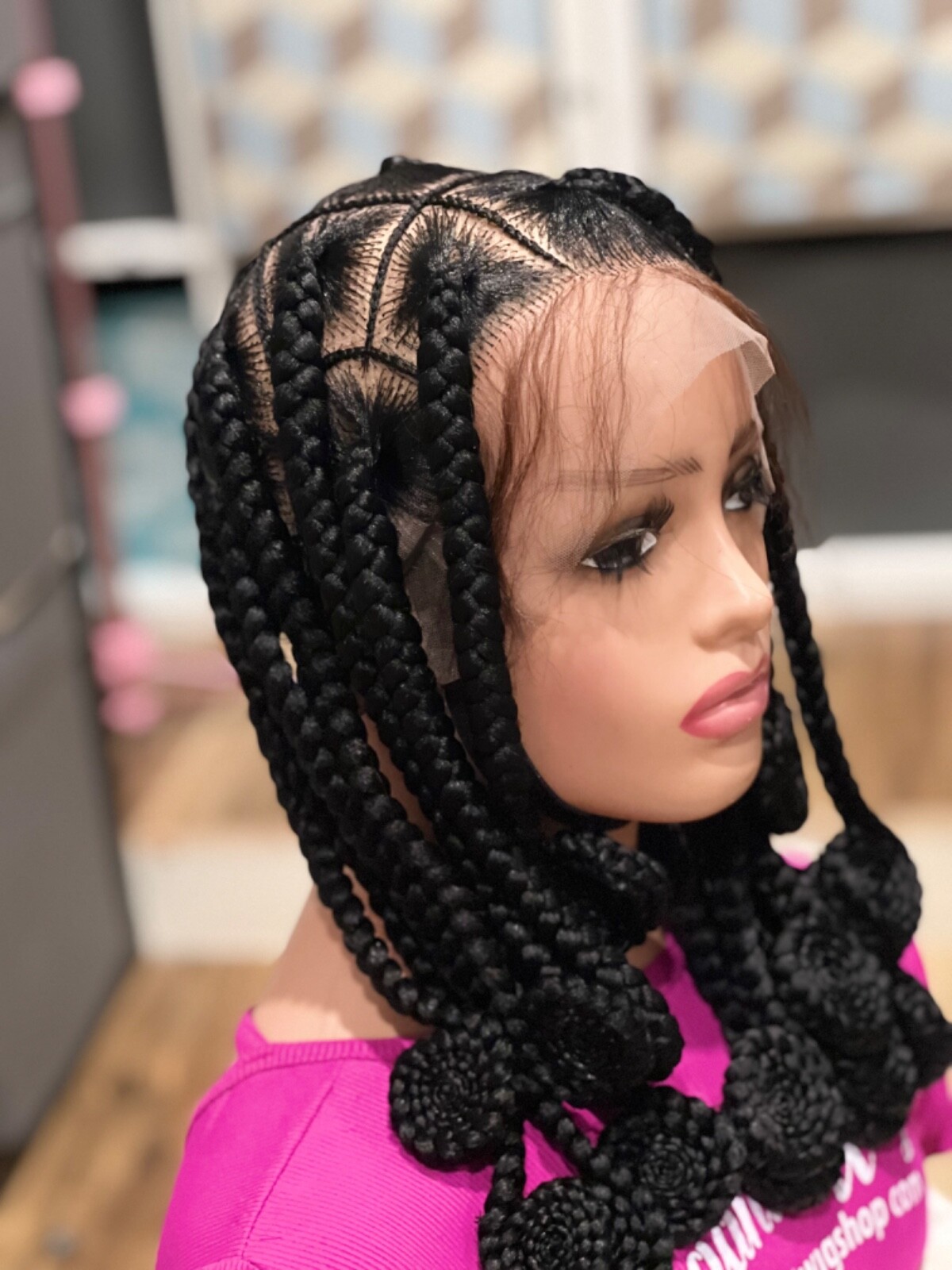 Knotless braided wig, made on a full lace wig. Length Is 16”long.