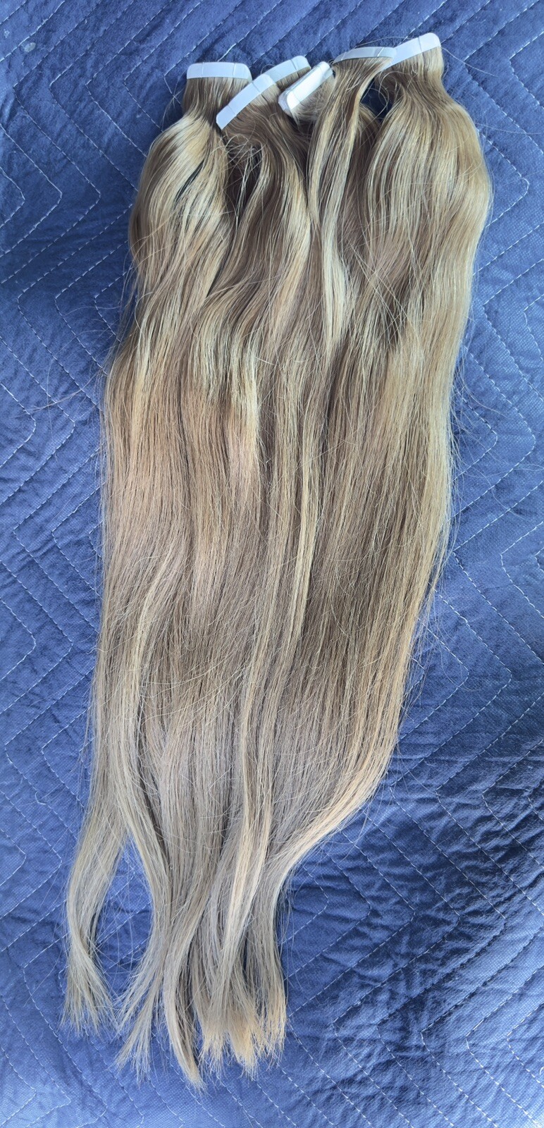 Tape hair extensions with a slight wave