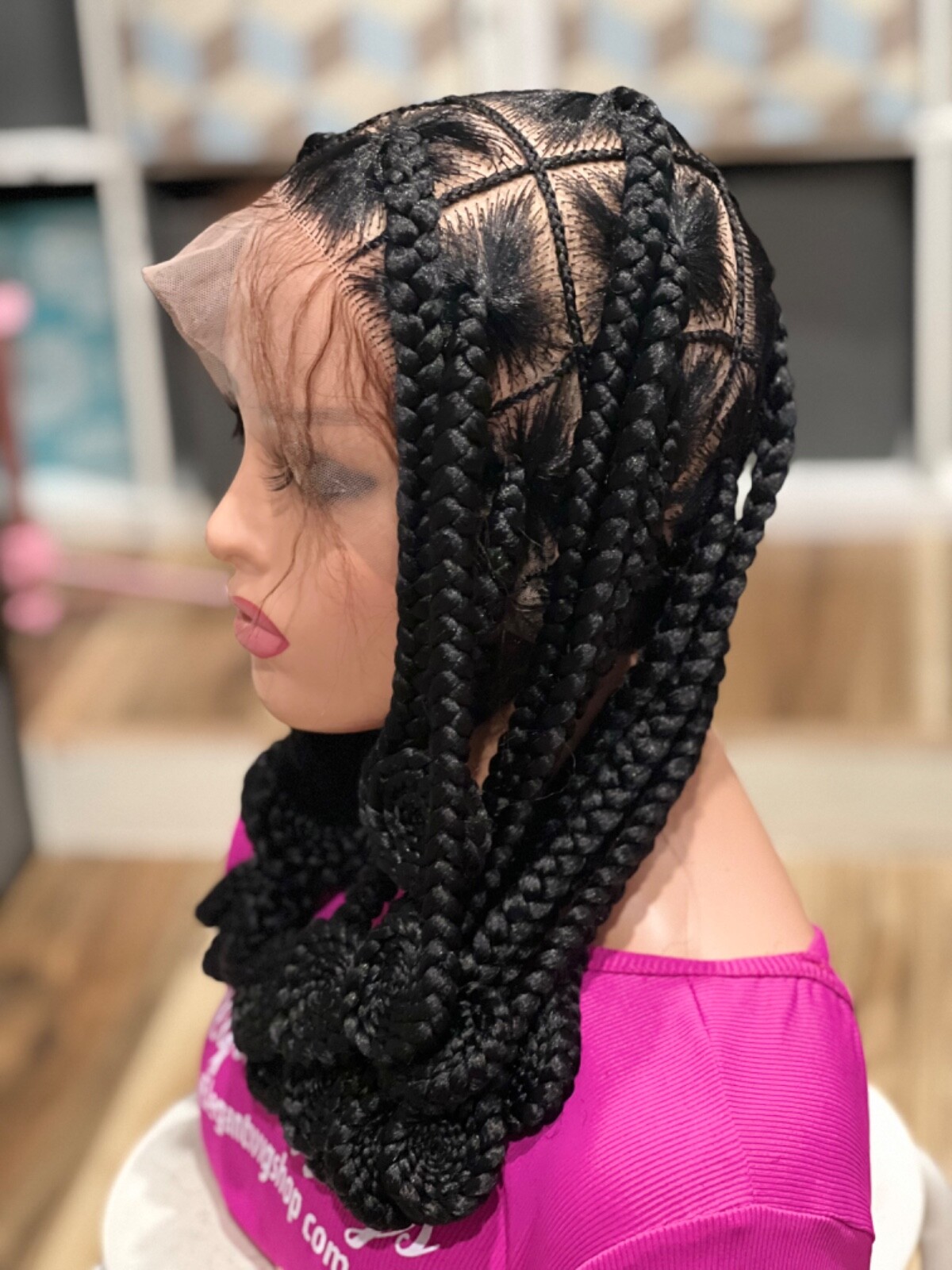 Knotless braided wig, made on a full lace wig. Length Is 16”long.