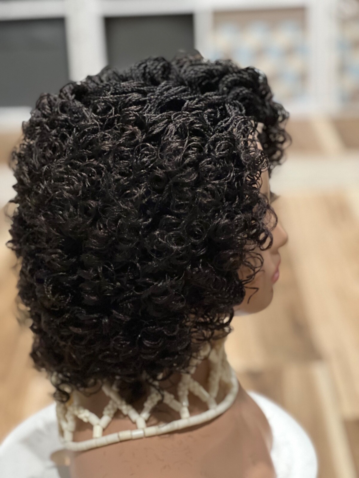 Braided micro twist afro curly wig. just as pictured. color is Brown mix
