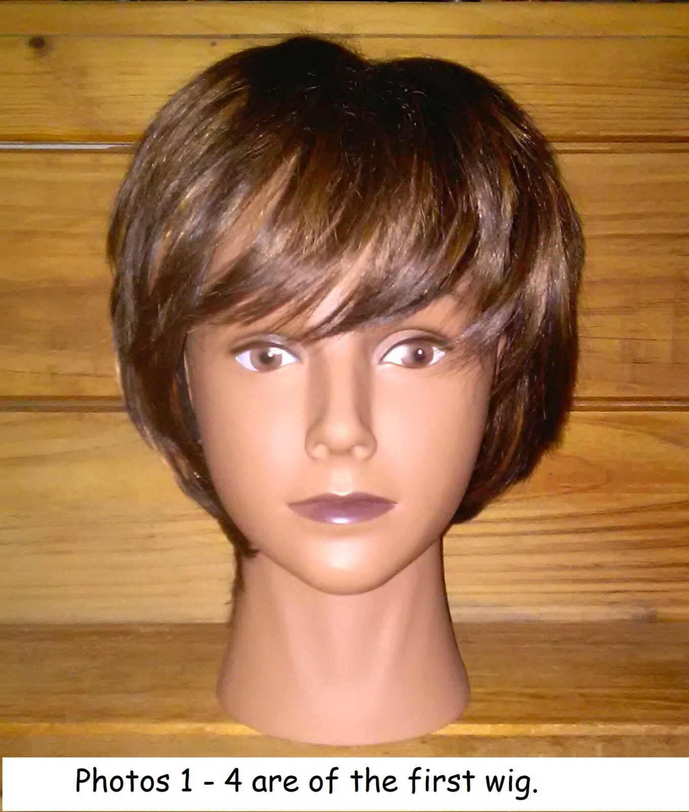 (23-1) TWO WIGS, THREE PAIR OF EYELASHES, ONE CLAMP, AND A HEAD