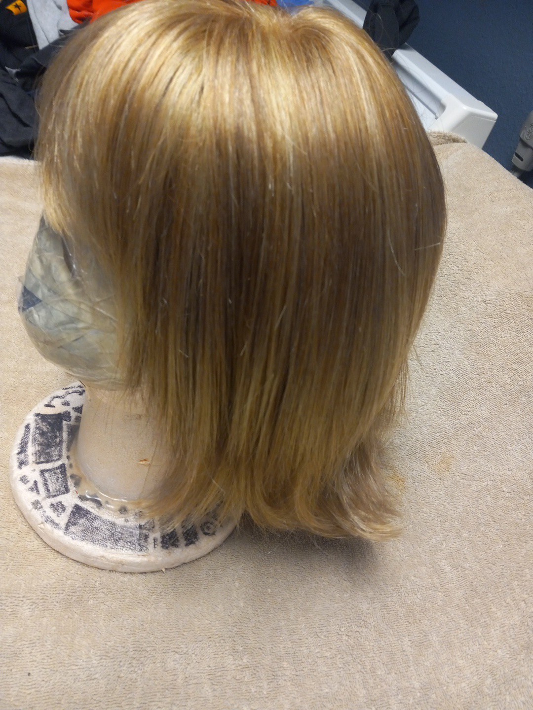 Raquel Welch Synthetic Wig. Color: Light Brown With Light Highlights