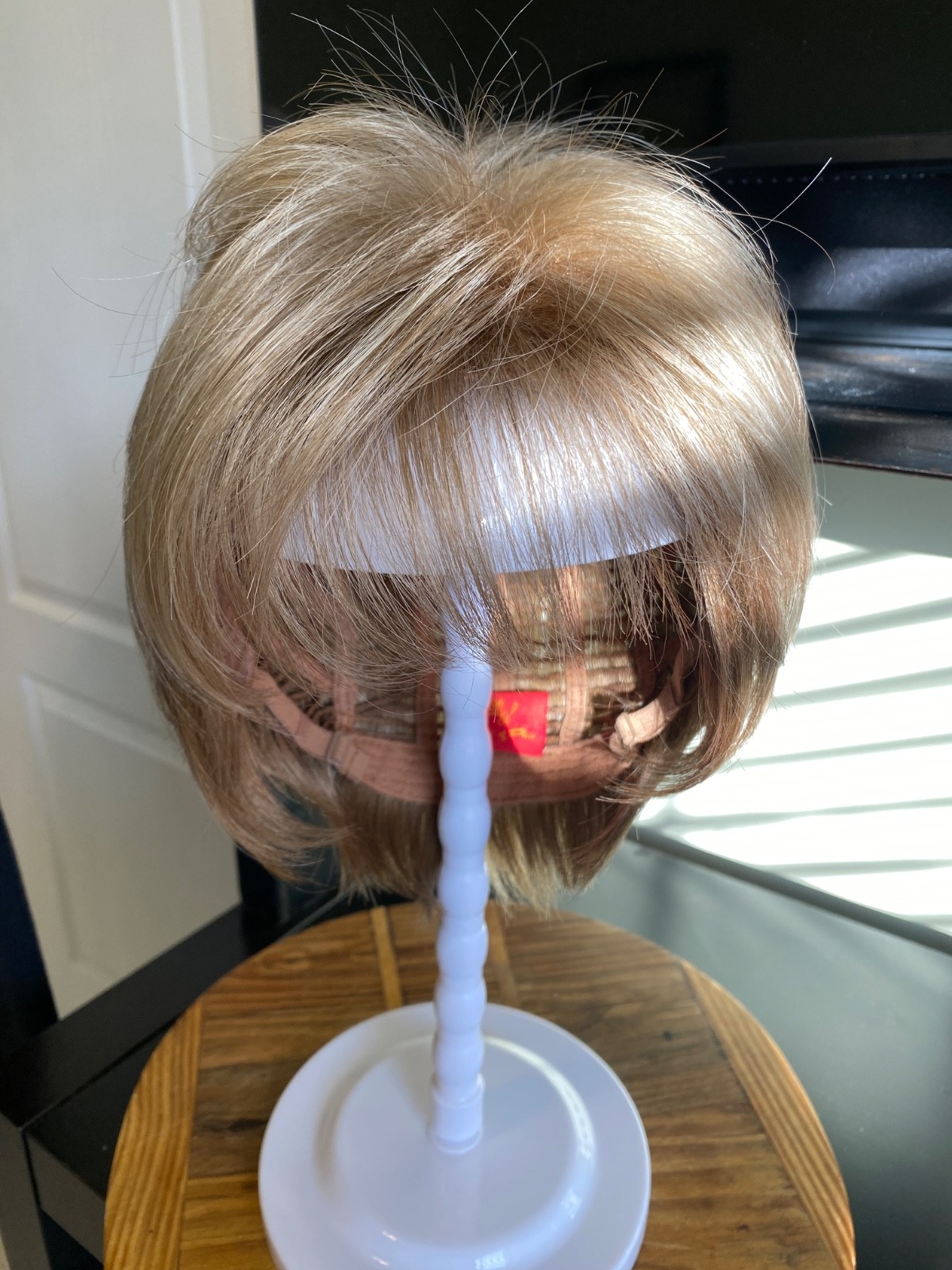 Rene of Paris: Wig – Ash Blond. Comes with stand brush and wig shampoo. (Boxed)