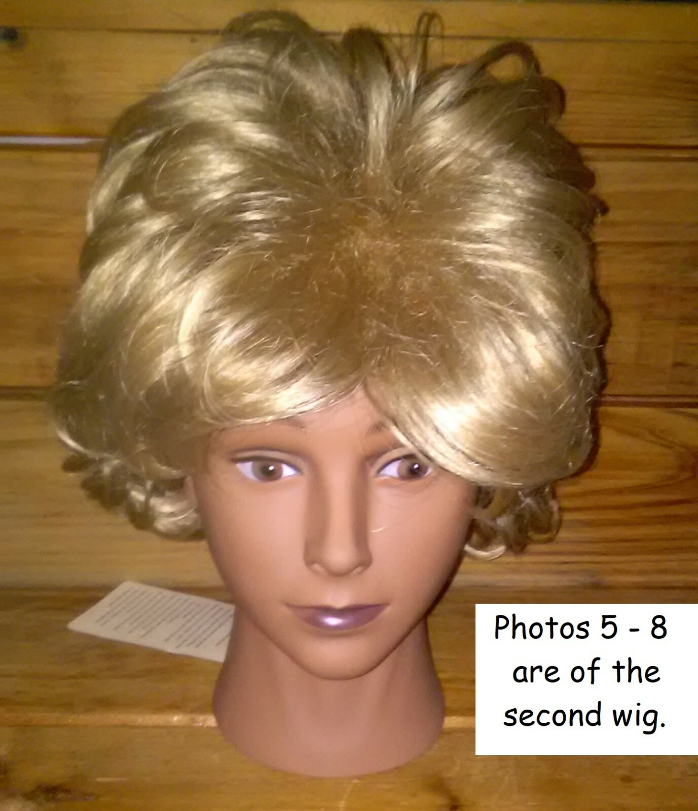 (23-1) TWO WIGS, THREE PAIR OF EYELASHES, ONE CLAMP, AND A HEAD