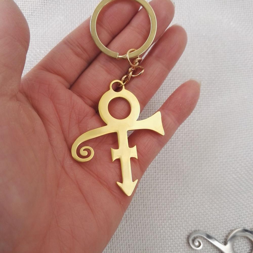 Sanlan 1pcs New Style Fashion Style Glowing Purple Prince Symbol Keychain Purple