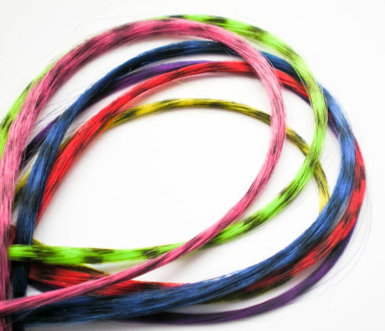 Yellow feather hair extension clip in, thin strand