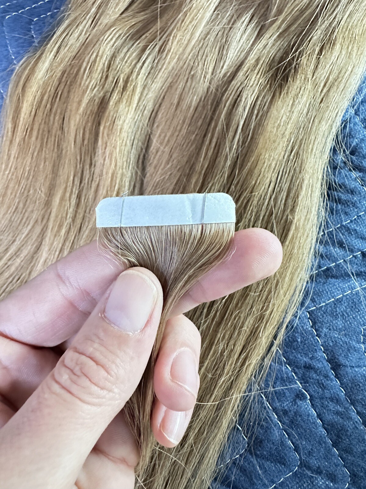 Tape hair extensions with a slight wave