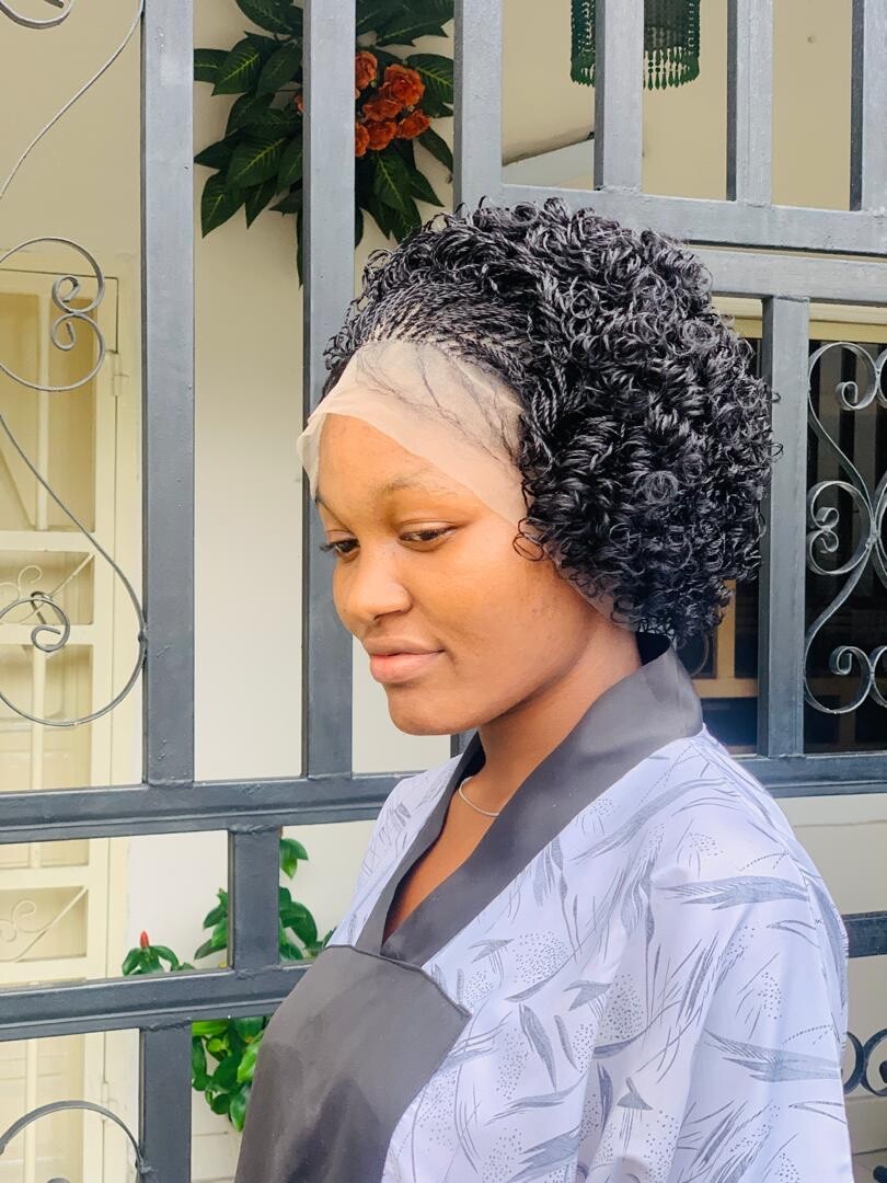 Braided micro twist wig with curly tips made on a full lace wig. Black women’s
