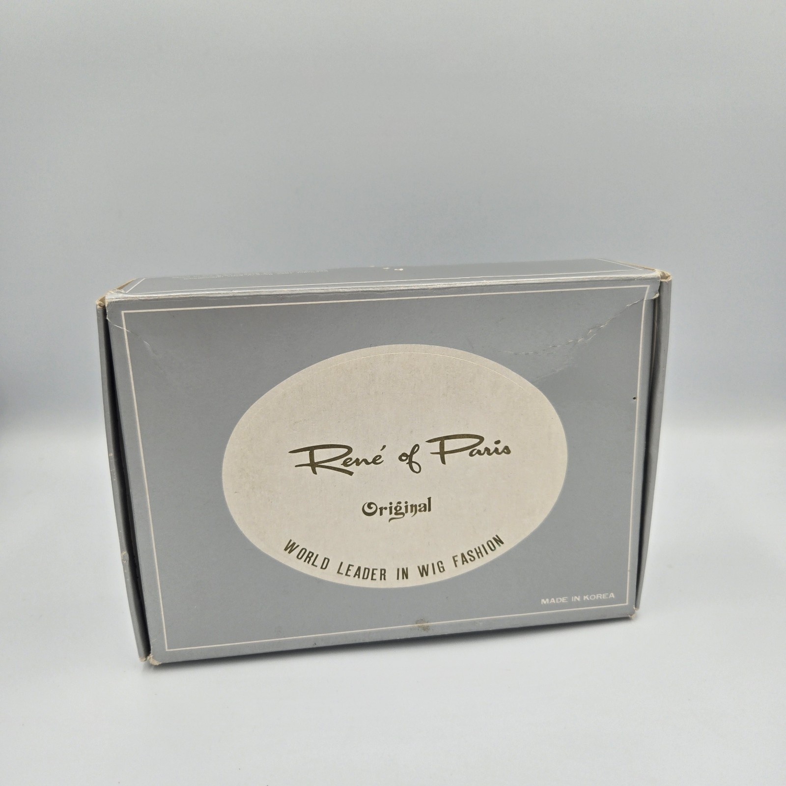 Rene of Paris Original Elura Blend Pixie Wig by Monsanto Genie 507 Blonde 18/22
