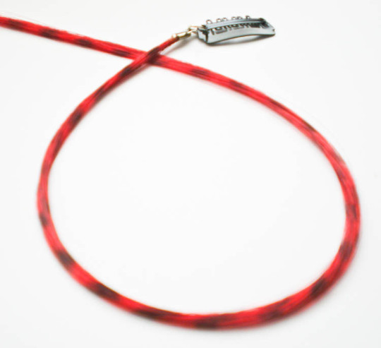 Red feather hair extension clip in, thin strand