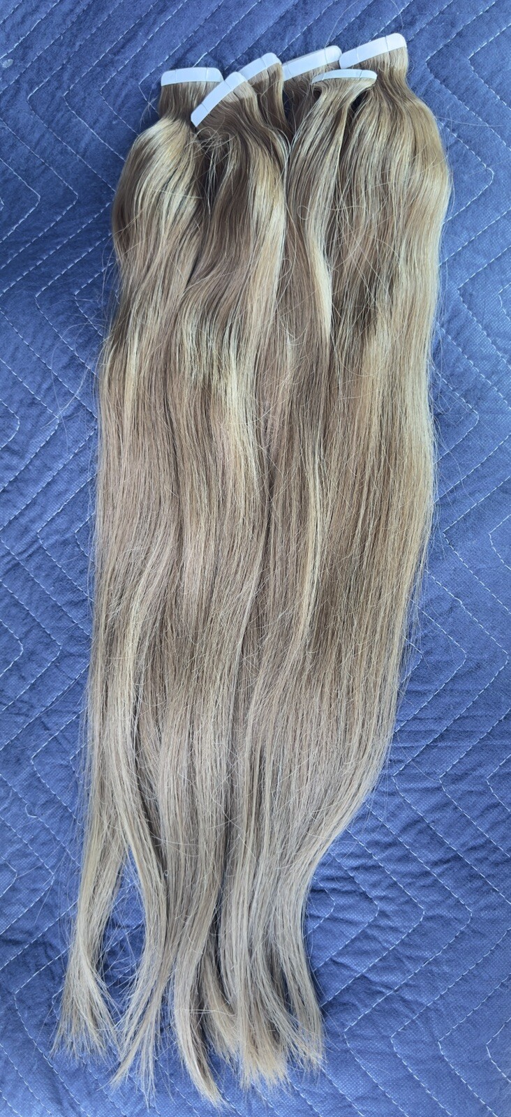 Tape hair extensions with a slight wave