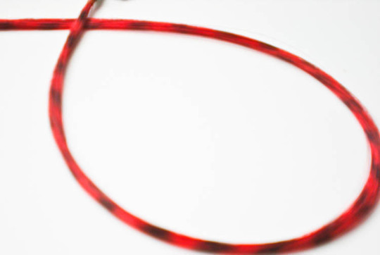Red feather hair extension clip in, thin strand