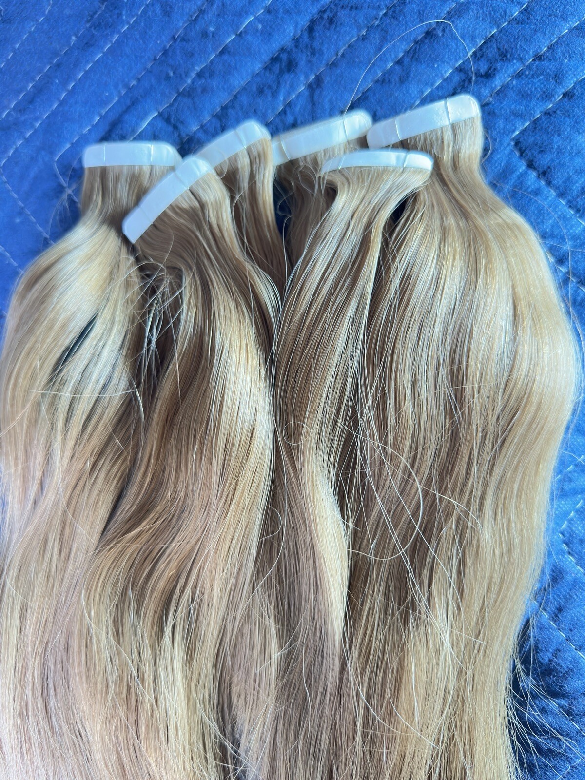 Tape hair extensions with a slight wave