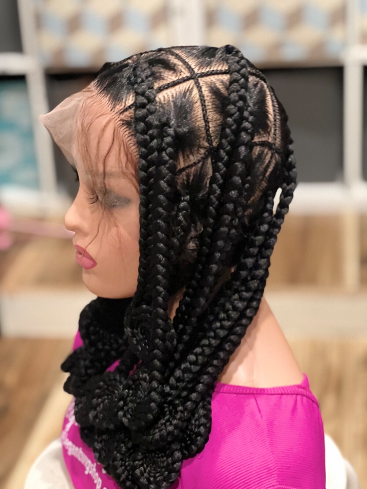 Knotless braided wig, made on a full lace wig. Length Is 16”long.