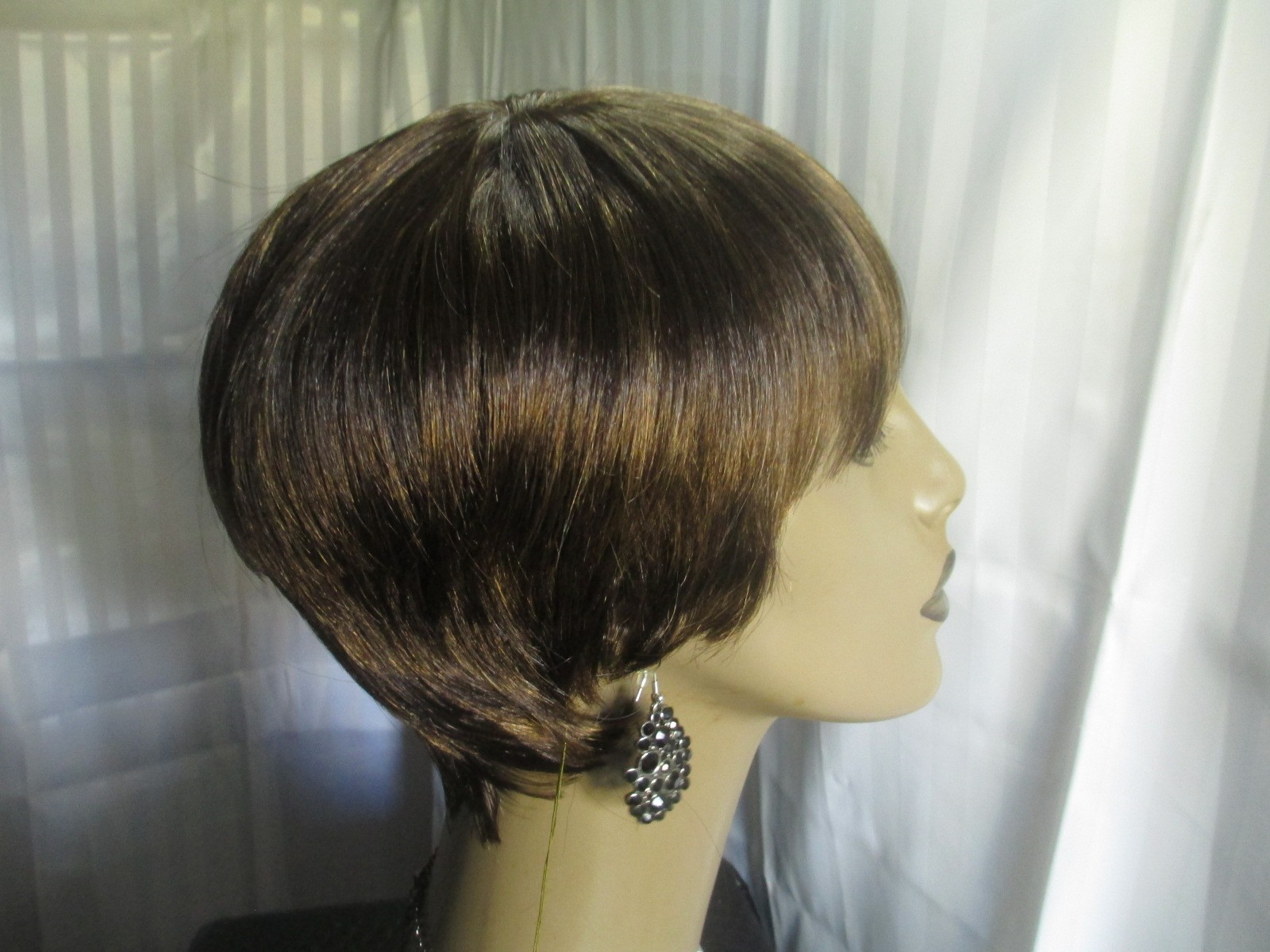 its a wig shortstraight w/bangs dark brown w/strawberry blonde easy to style NEW