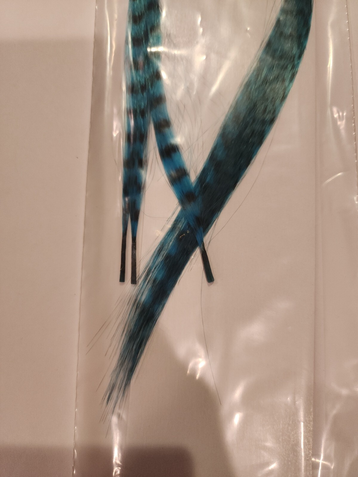 Feather hair extension Blue & black 3 Feathers bonded together at the tip