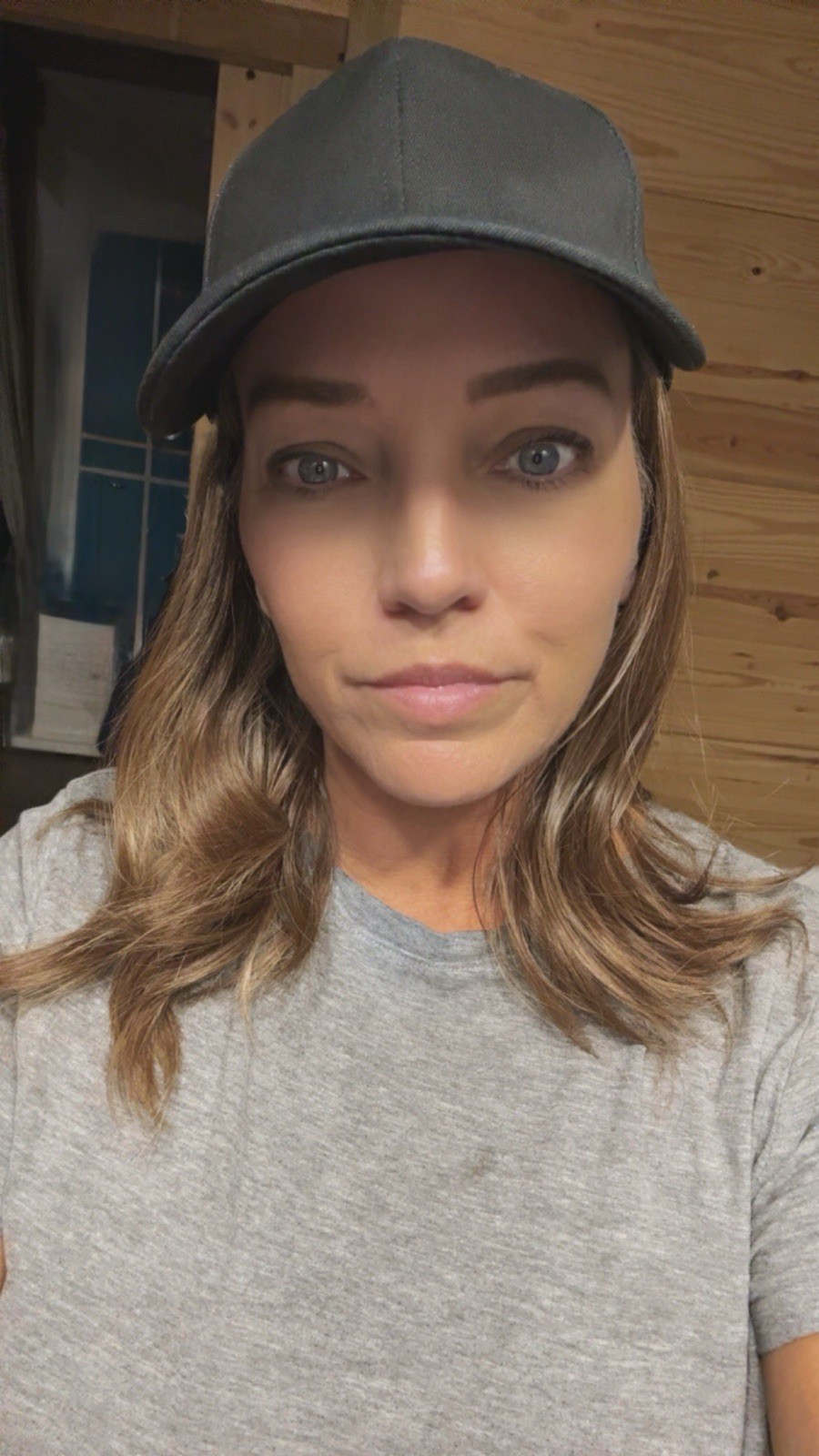 Chelsey Smith Crowns. Black Baseball Hat With Wave And Straight Hair.