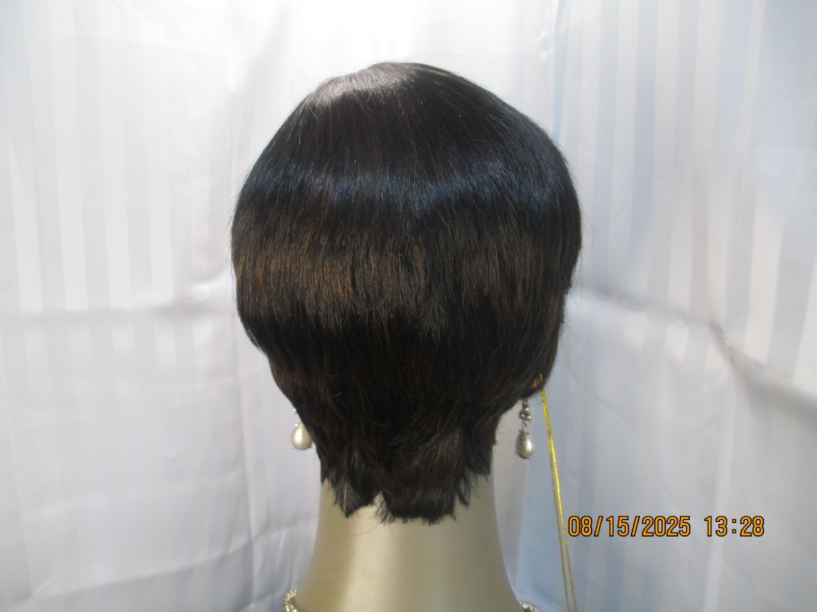 its a wig short sleek w/bangs black color 1B no styling heat safe cute NEW