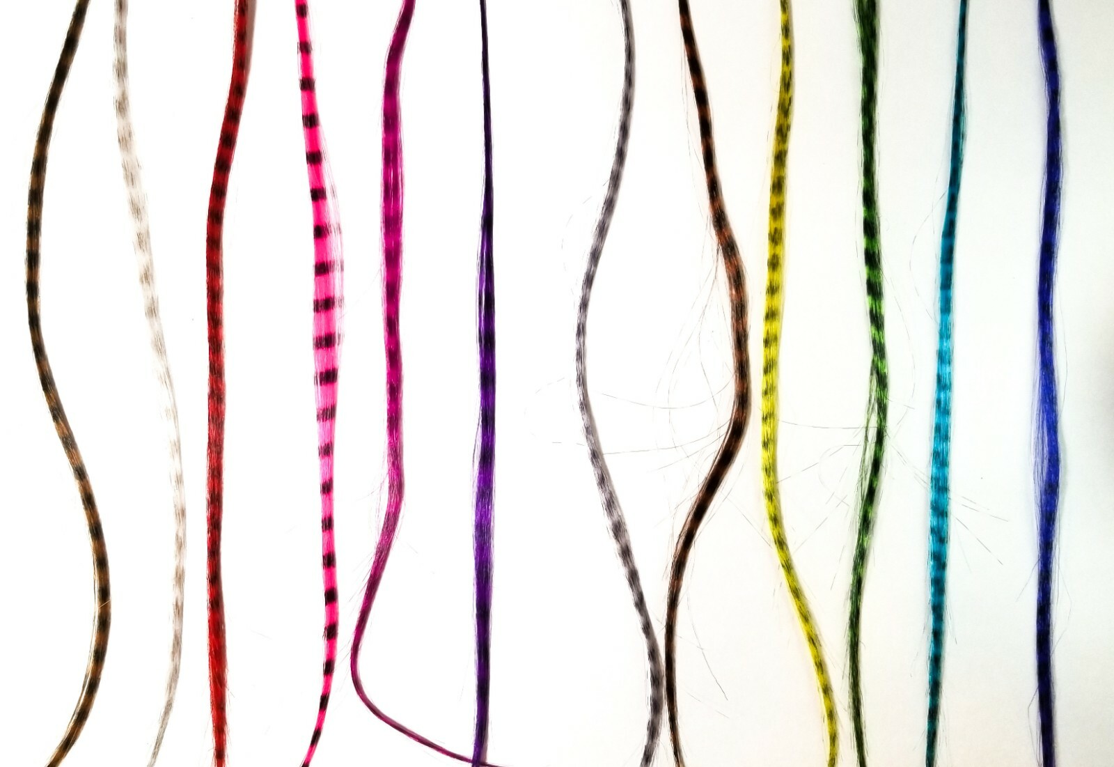 Yellow feather hair extension clip in, thin strand