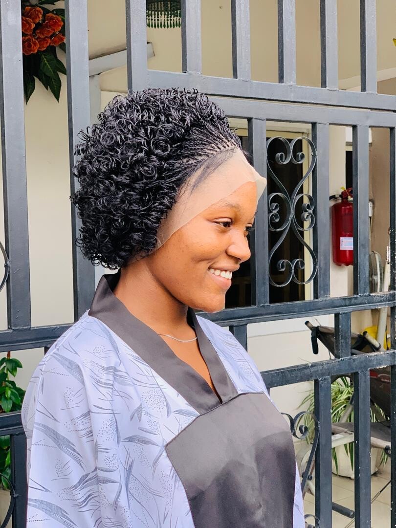 Braided micro twist wig with curly tips made on a full lace wig. Black women’s