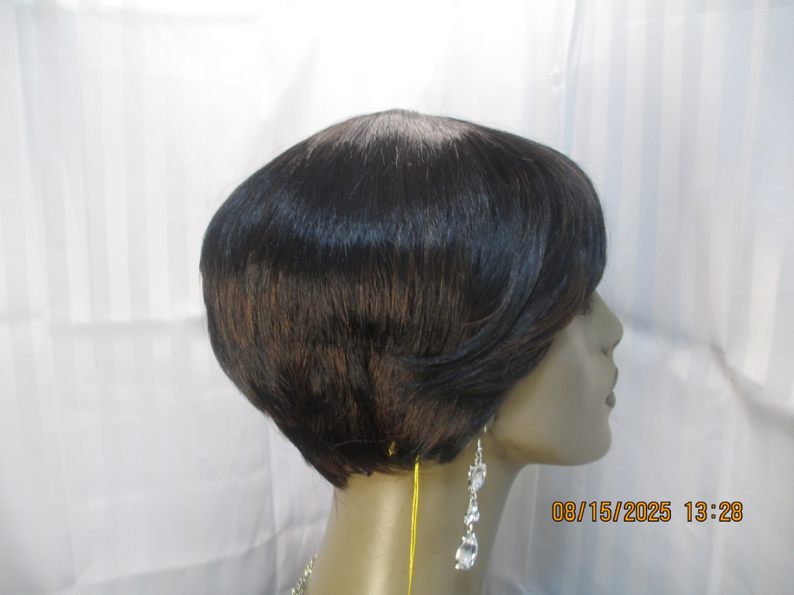 its a wig short sleek w/bangs black color 1B no styling heat safe cute NEW
