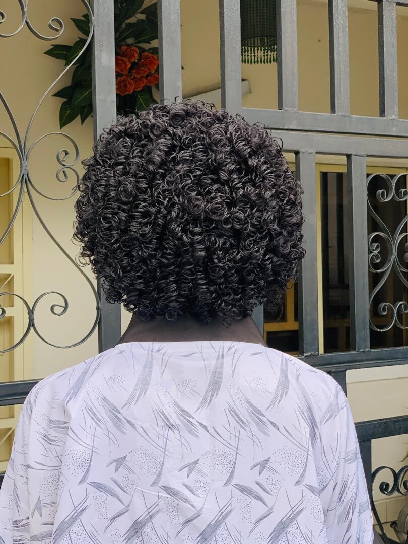 Braided micro twist wig with curly tips made on a full lace wig. Black women’s