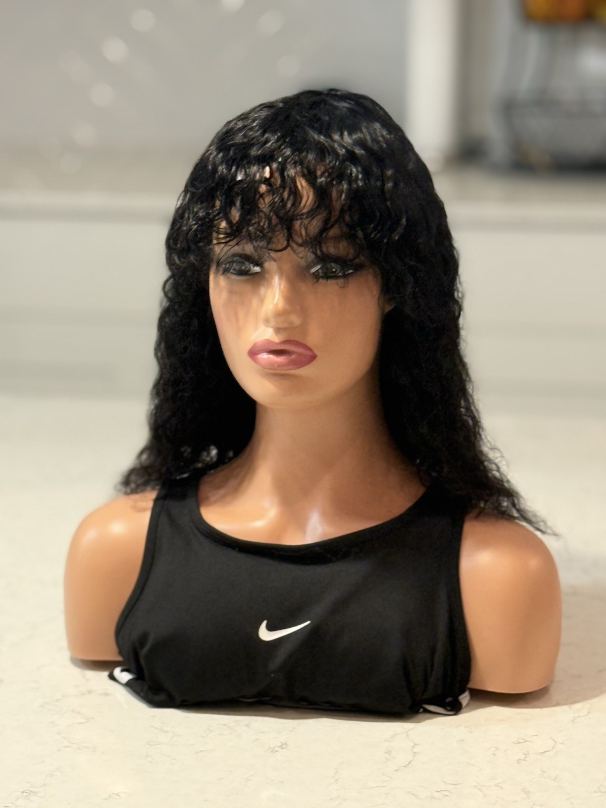Human hair bang Black Curly Wig. Length Is 14”long.