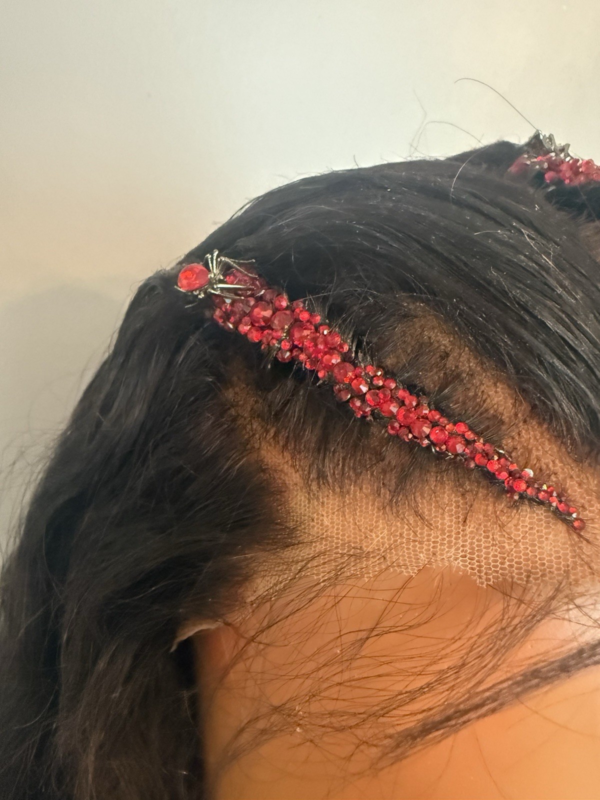 Custom styled human hair wig worn once. 13×6,30 in. w braids, crystals & spiders